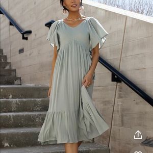 Brand new dress, never worn, safe green mid length.